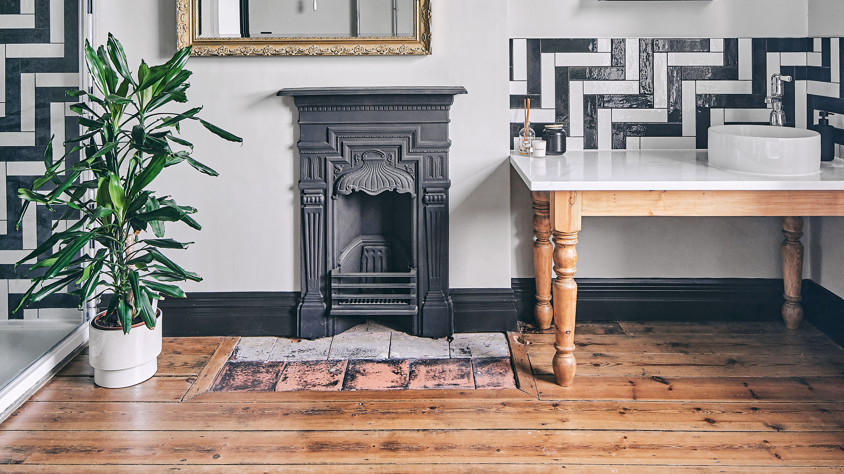 small cast iron all-in-one fireplace in bathroom