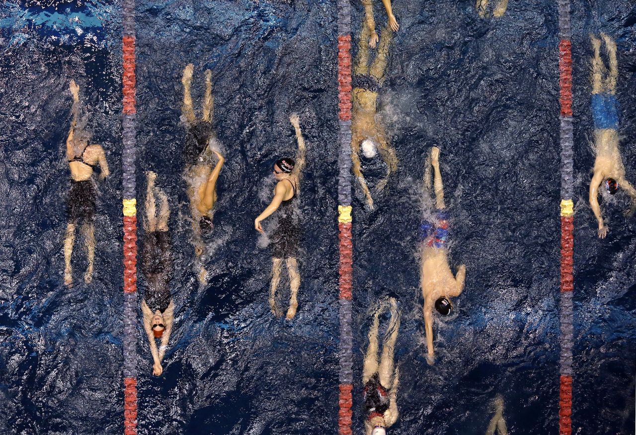 Swimmers warm-up during the U.S. Winter Nationals swimming event in Federal Way, Wash.