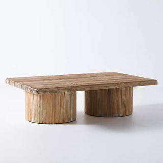 wooden coffee table with large cylindrical legs