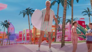 Ryan Gosling as Ken in pastel pink and green swim suit
