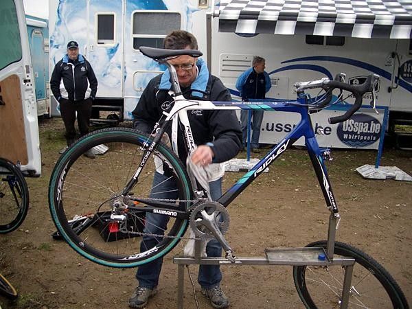 Klaas Vantornout's bike is given a coating of something to try and keep the muck from sticking.