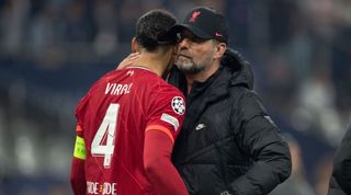 Liverpool manager Jurgen Klopp hugs Virgil van Dijk after losing the Champions League final