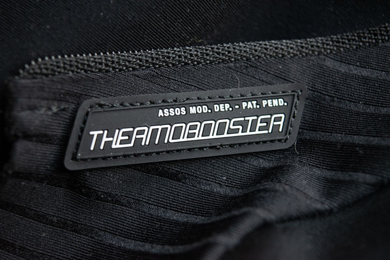 A black Thermobooster base layer on a wooden table