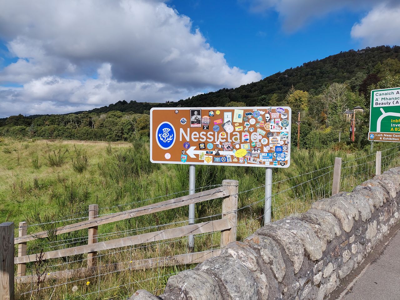 A camera sample taken on the Fairphone 6 showing a sign for 'Nessieland' covered by stickers.