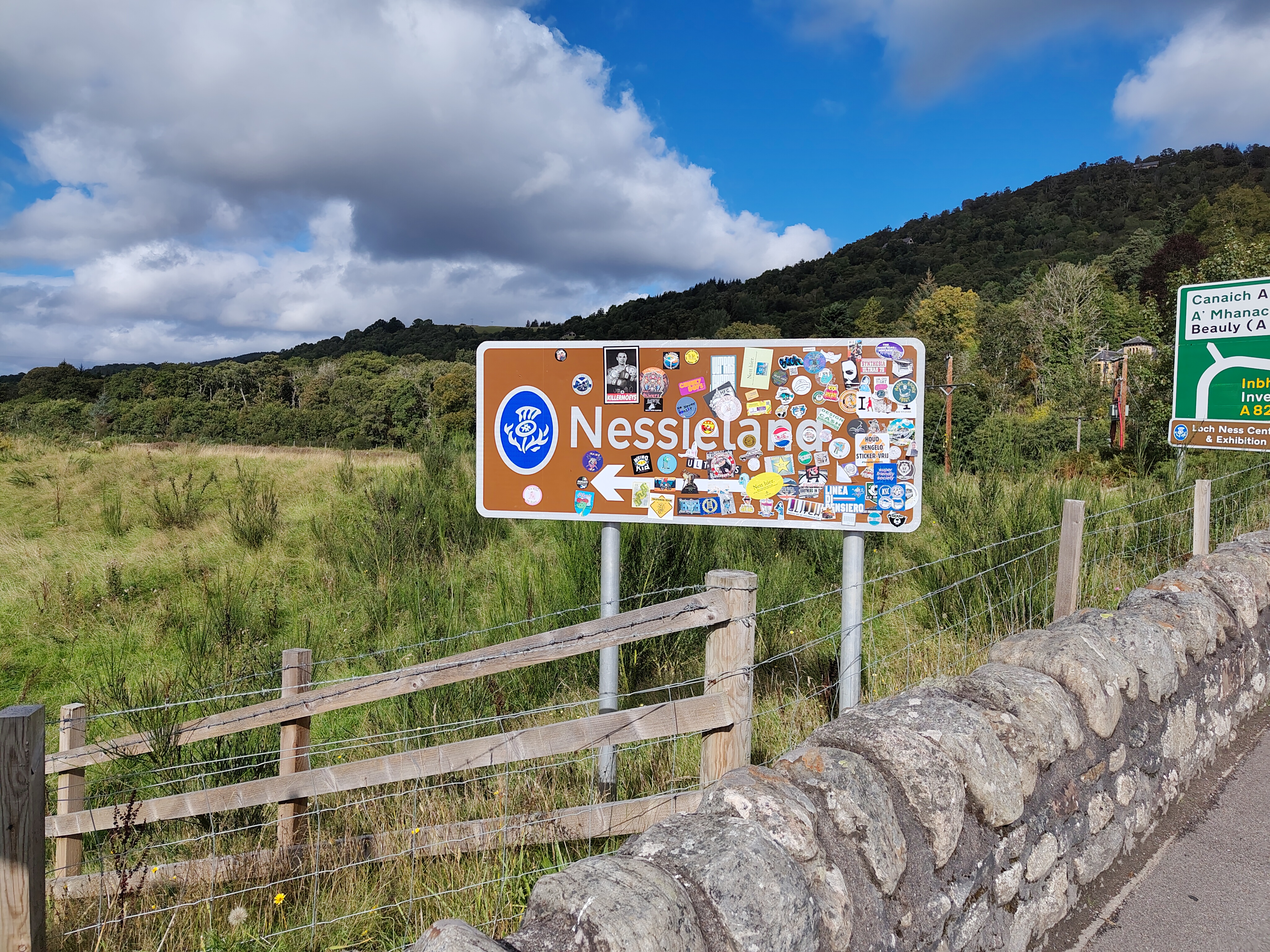 A camera sample taken on the Fairphone 6 showing a sign for 'Nessieland' covered by stickers.