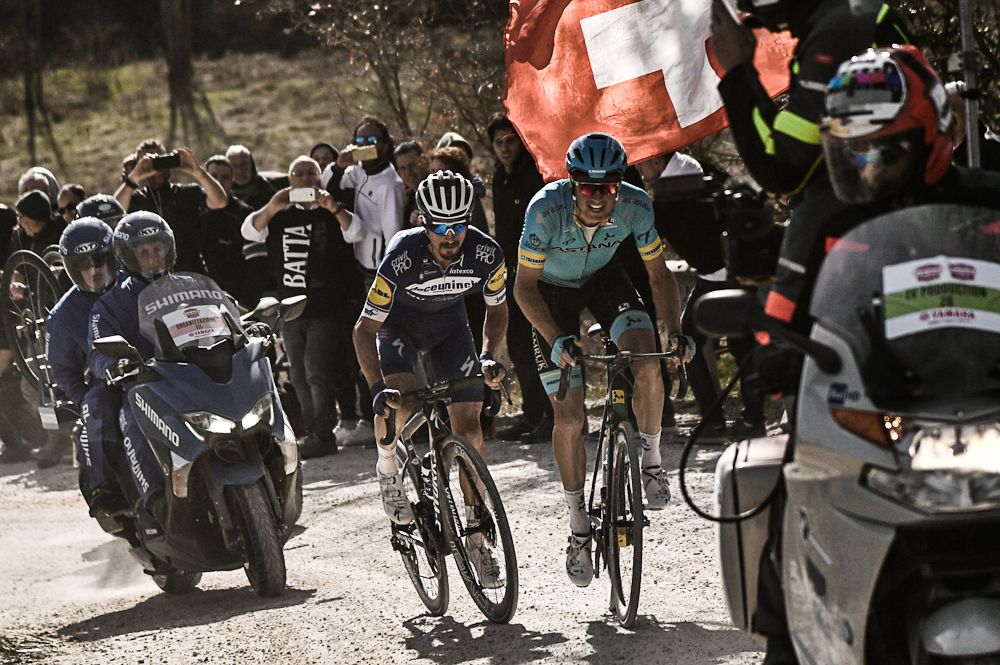 Julian Alaphlippe and Jakob Fuglsang ride to the finish of Strade Bianche
