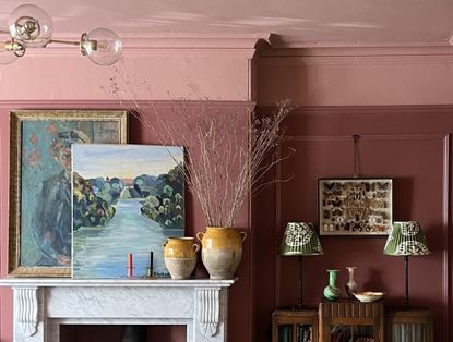 A two toned pink living room with light pink ceiling