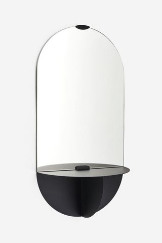 Oblong minimalist mirror with metal shelf from H&M Home.