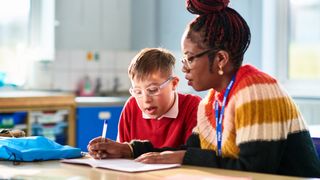 Disabled child and teacher