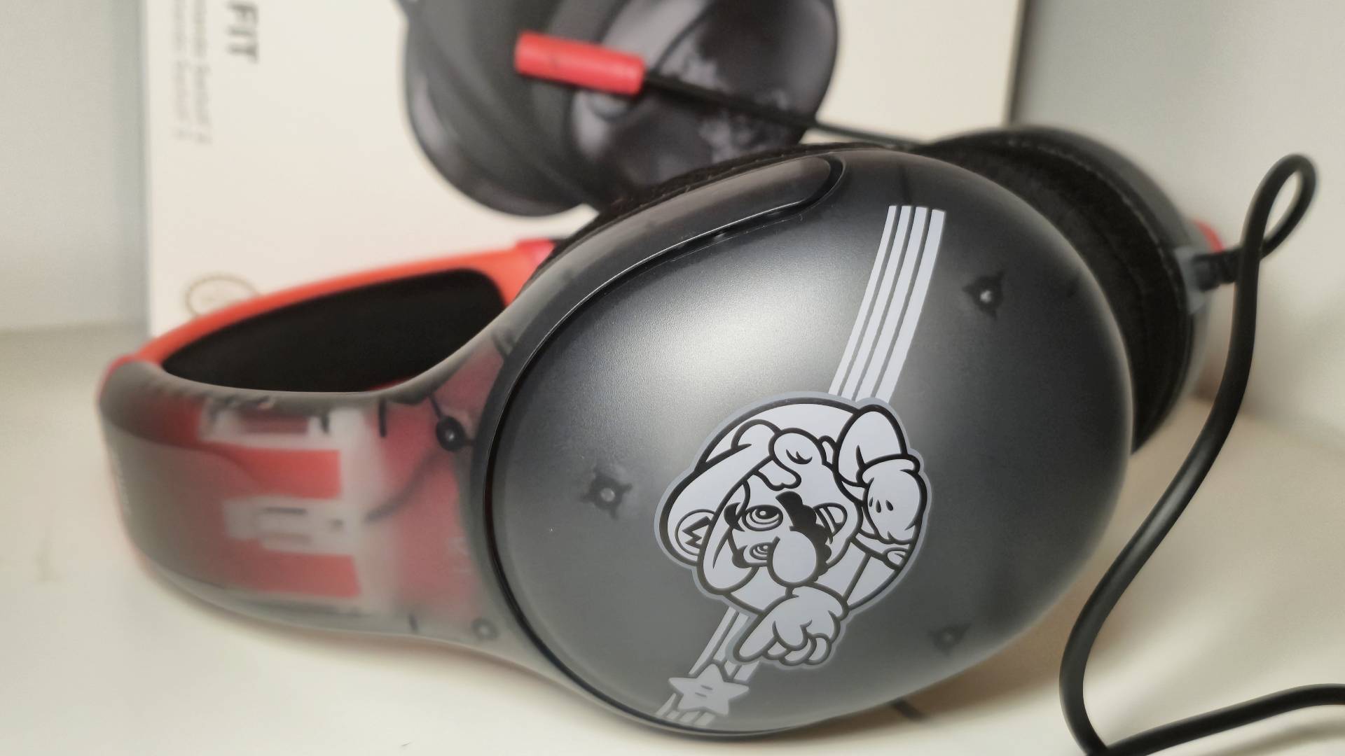 Close up of the 'Mario Star' art on the side of the Turtle Beach Airlite Fit wired headset.