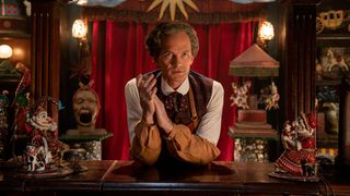 The Toymaker (Neil Patrick Haris) surrounded by trinkets in the Doctor Who 60th anniversary specials