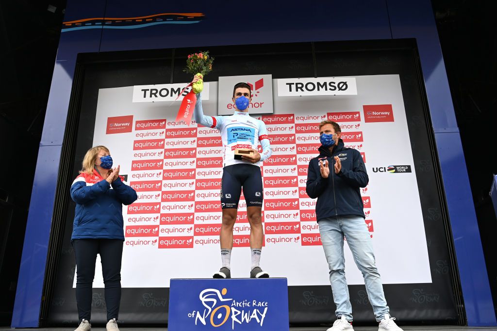 TROMSO NORWAY AUGUST 05 Samuele Battistella of Italy and Team Astana Premier Tech White Best Young Rider Jersey celebrates at podium during the 8th Arctic Race Of Norway 2021 Stage 1 a 1425km stage from Troms to Troms ArcticRace on August 05 2021 in Tromso Norway Photo by Stuart FranklinGetty Images