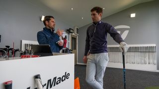 A golfer and a club fitter at Kingsfield Golf Centre