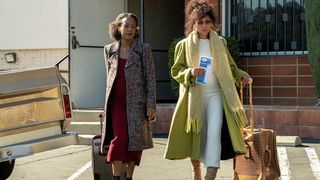 Devyn Tyler as Veronique and Tamara Taylor as Cassandra walking with luggage in Snowfall season 6