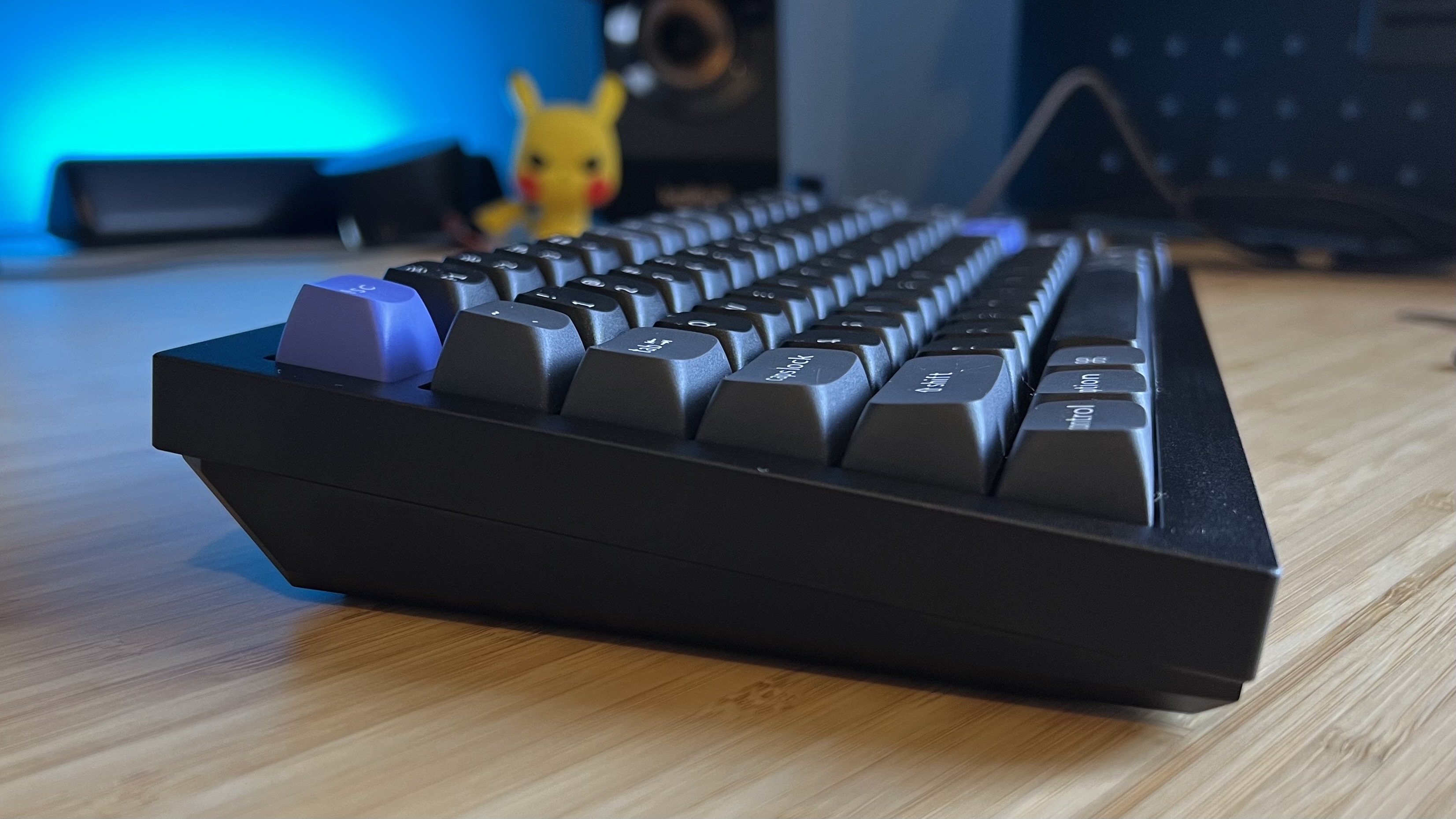 Side view of Keychron Q1 HE 8K gaming keyboard elevation on a wooden desk
