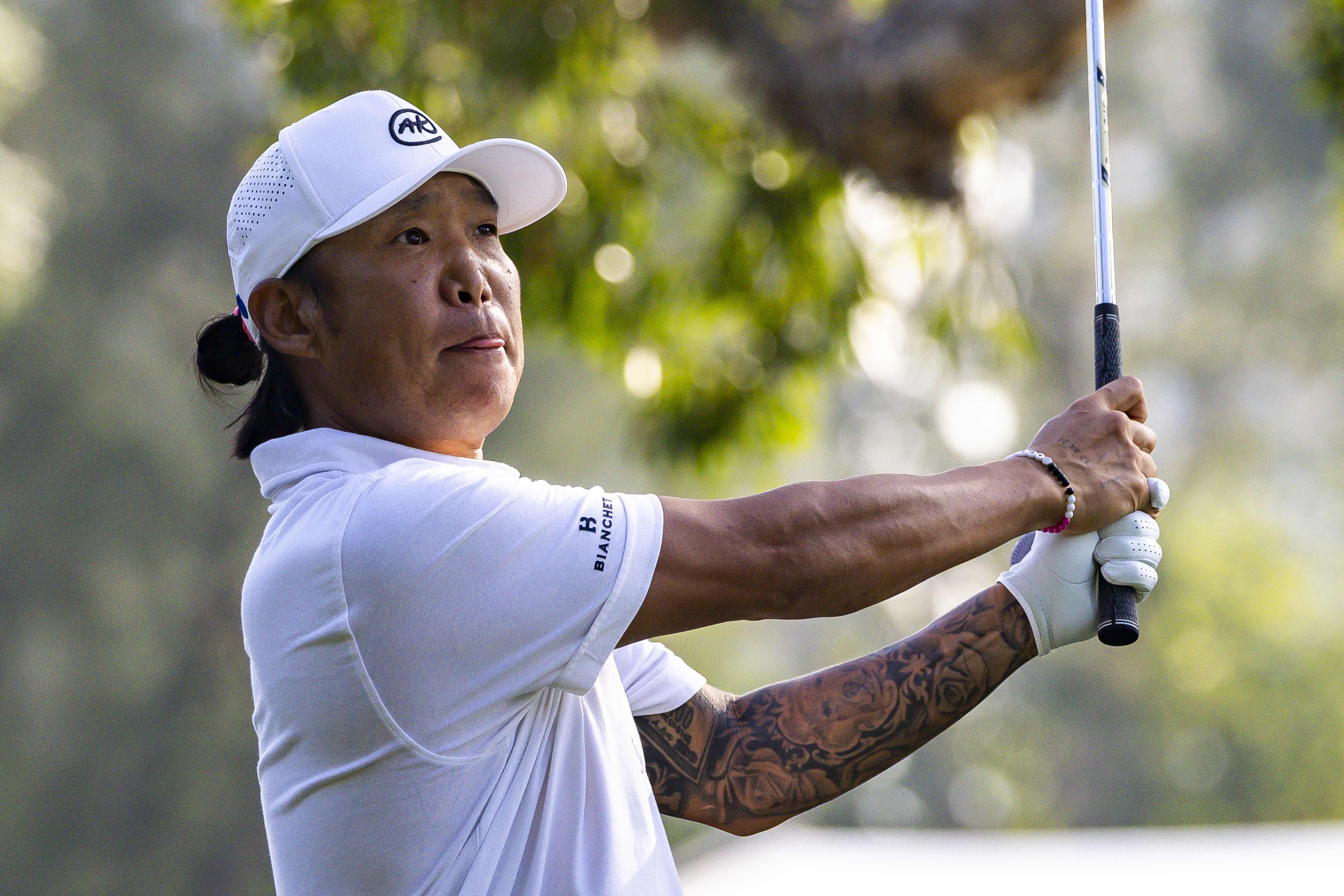 Anthony Kim watches an iron shot