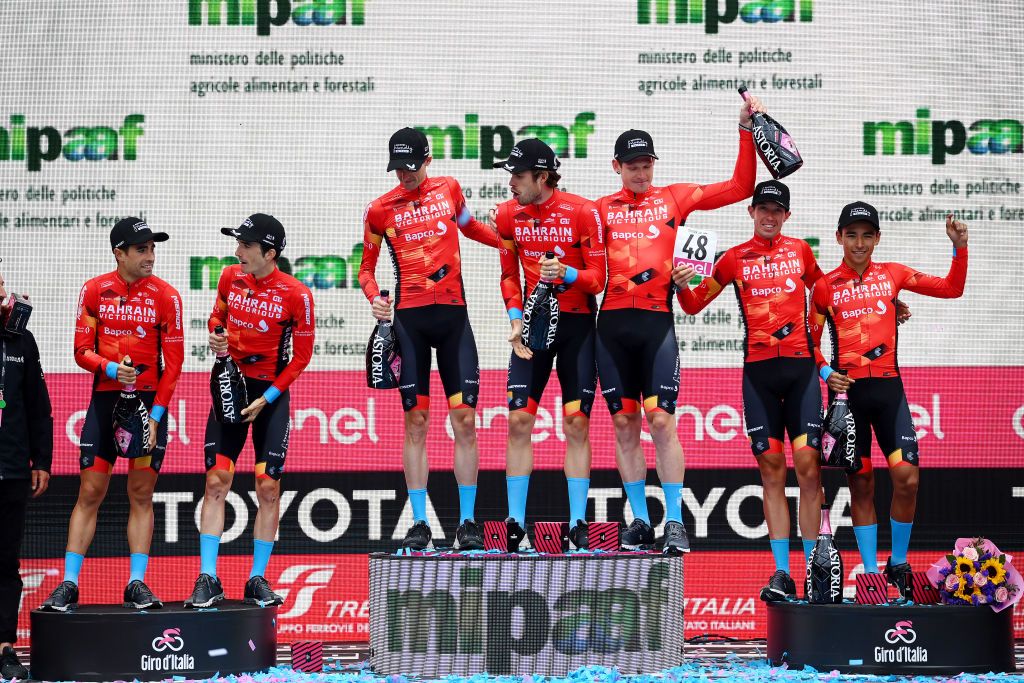 VERONA ITALY MAY 29 Pello Bilbao Lpez De Armentia of Spain Phil Bauhaus of Germany Santiago Buitrago Sanchez of Colombia Mikel Landa Meana of Spain Domen Novak of Slovenia Wouter Poels of Netherlands Jasha Stterlin of Germany and Team Bahrain Victorious celebrate at podium as best team overall winner the 105th Giro dItalia 2022 Stage 21 a 174km individual time trial stage from Verona to Verona ITT Giro WorldTour on May 29 2022 in Verona Italy Photo by Tim de WaeleGetty Images