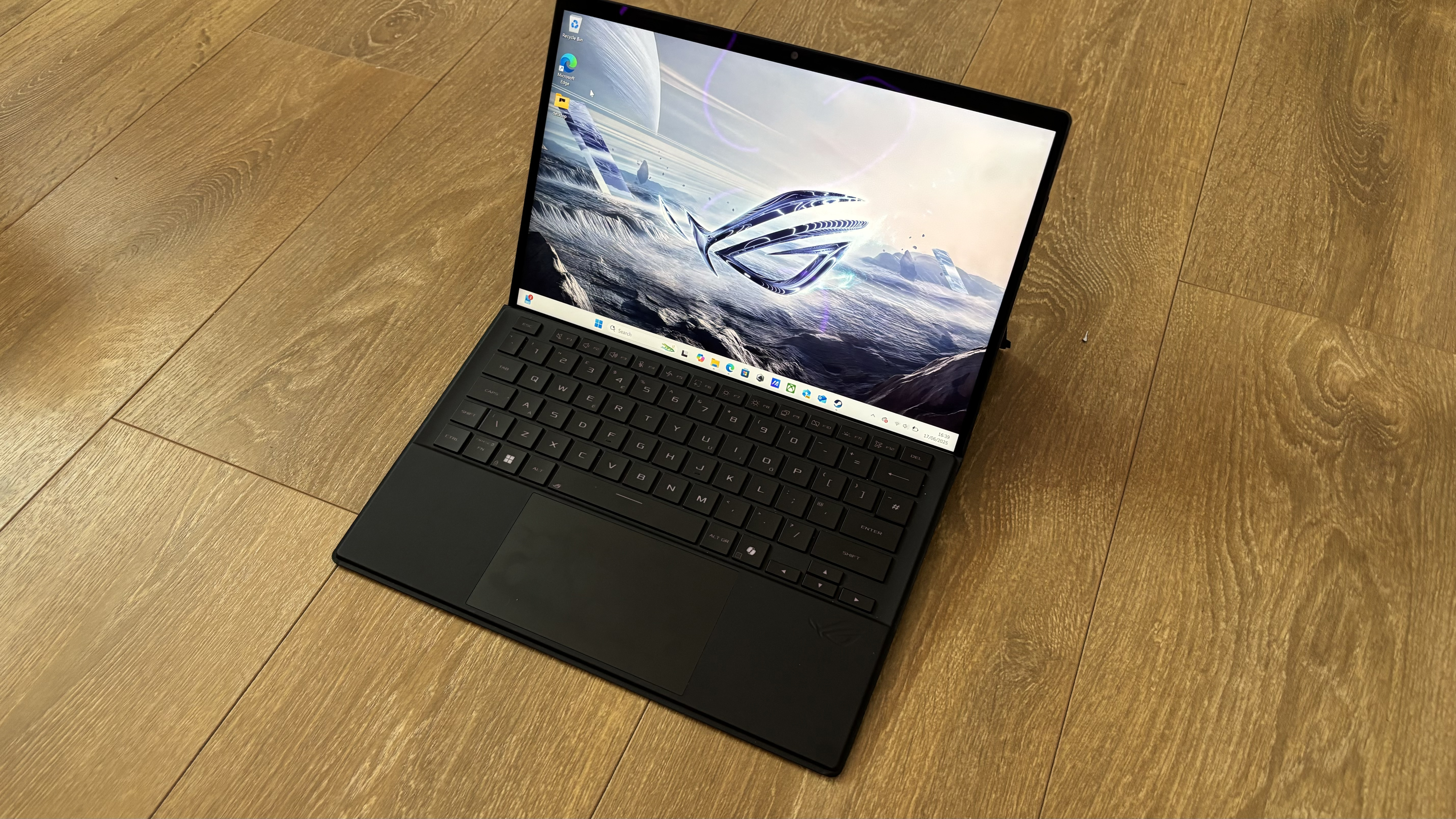 Asus ROG Flow Z13 gaming tablet on wooden surface
