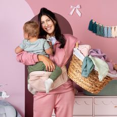 Becca Kufrin holding her child.