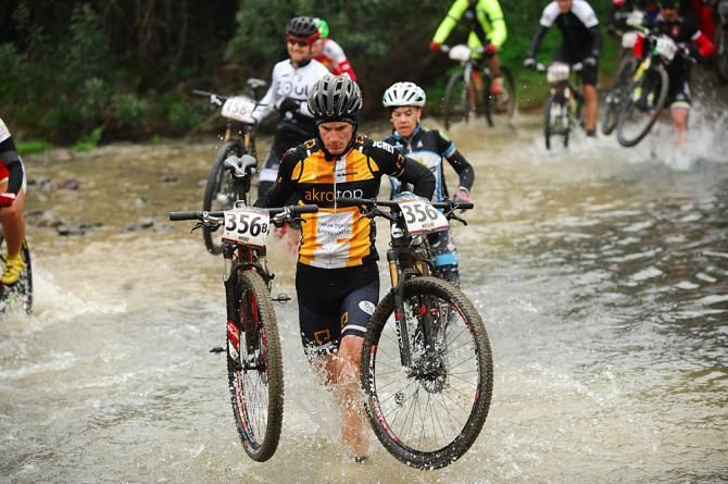 Racers cross a stream on the final day of racing in Andalucia
