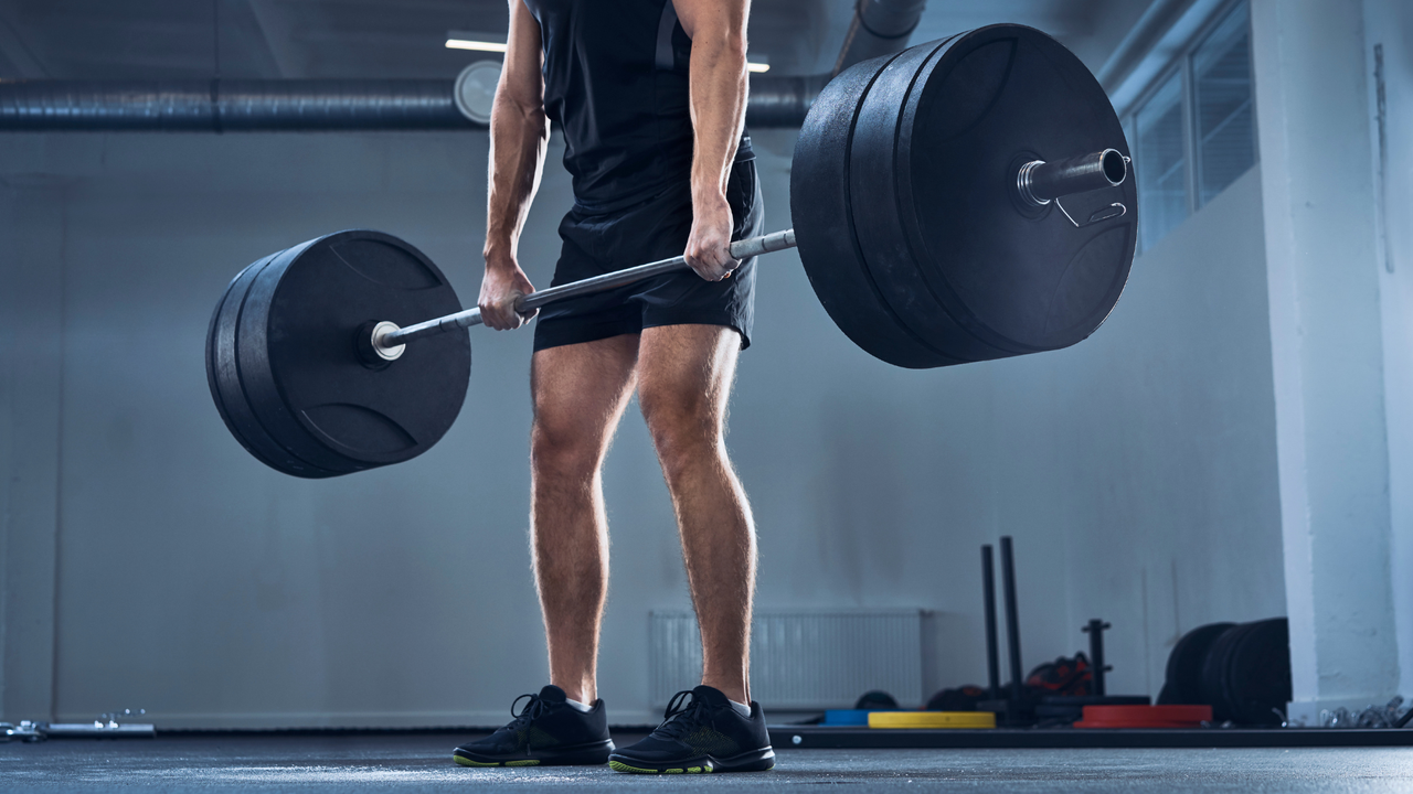 Man performing deadlifts