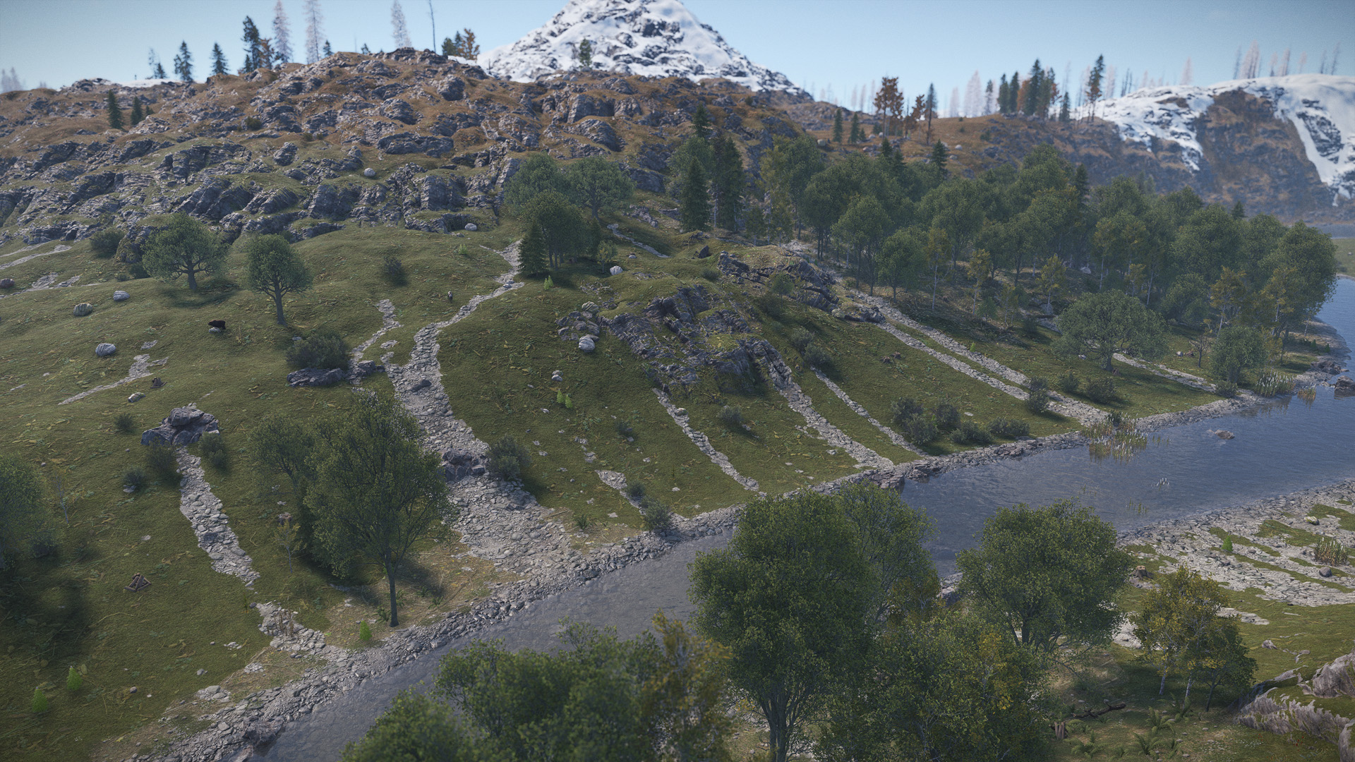 Scree slopes running down autumnal, snow-dusted mountains and green riverside valleys in Rust.