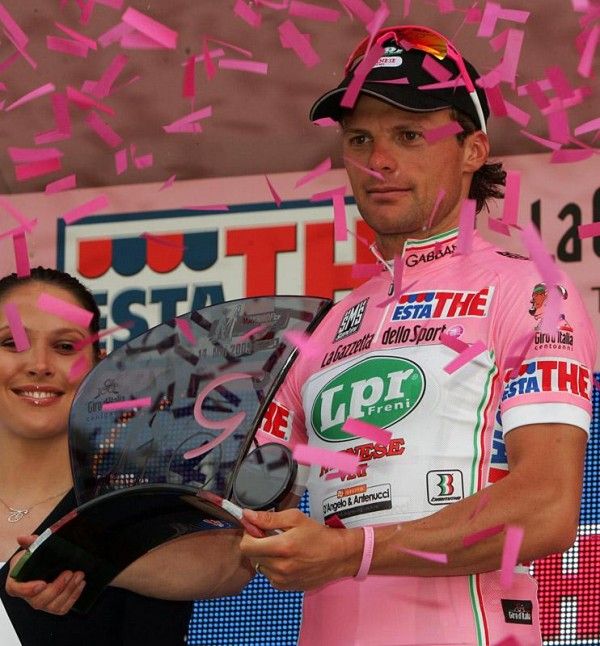 Danilo Di Luca displays the trophy earned as a reward for leading the Giro.