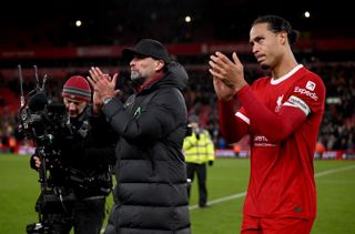 Jurgen Klopp and Virgil van Dijk applaud Liverpool's fans after the 0-0 draw against Manchester United in December 2023.