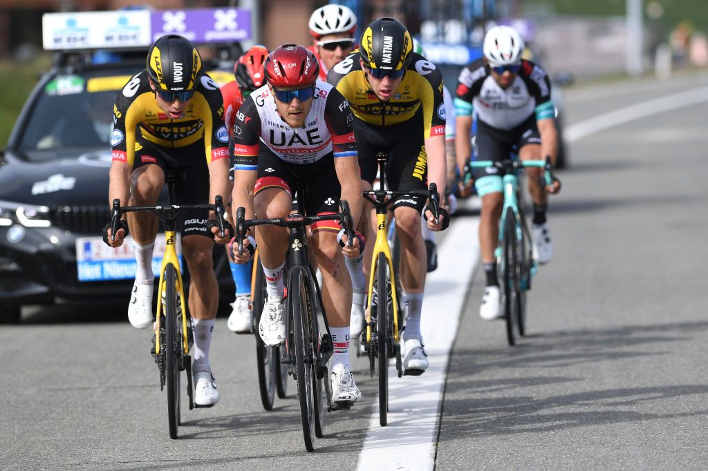 WEVELGEM BELGIUM MARCH 28 Wout Van Aert of Belgium and Team Jumbo Visma Matteo Trentin of Italy and UAE Team Emirates Nathan Van Hooydonck of Belgium and Team Jumbo Visma during the 83rd GentWevelgem in Flanders Fields 2021 Mens Elite a 254km race from Ypres to Wevelgem Breakaway GWE21 GWEmen FlandersClassic on March 28 2021 in Wevelgem Belgium Photo by Tim de WaeleGetty Images