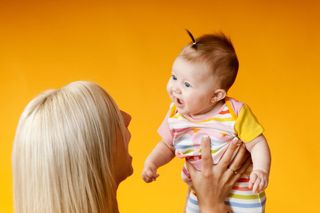 baby with mother