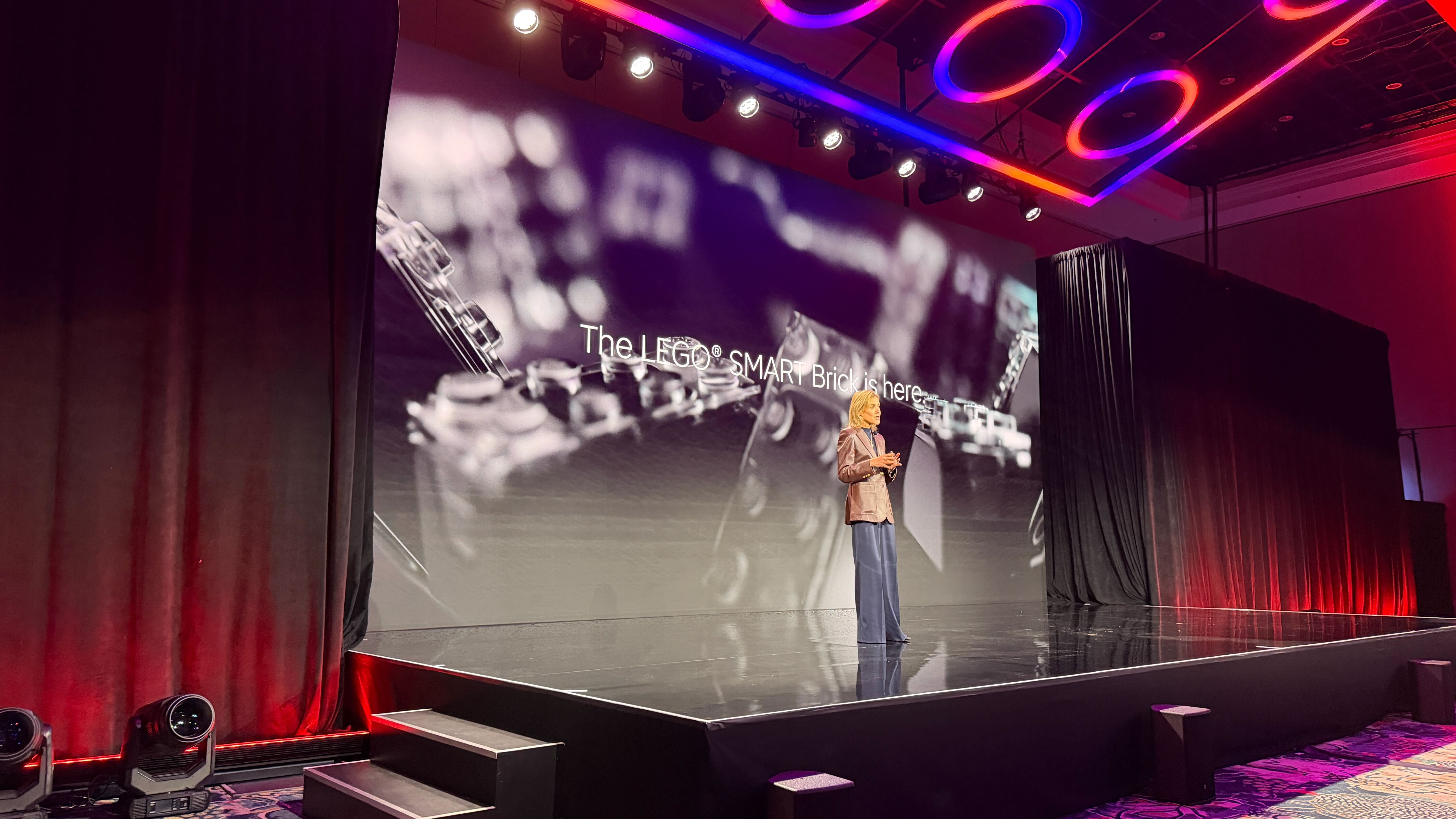 Lego executive on stage announcing the Lego Smart Brick at CES 2026 in Las Vegas