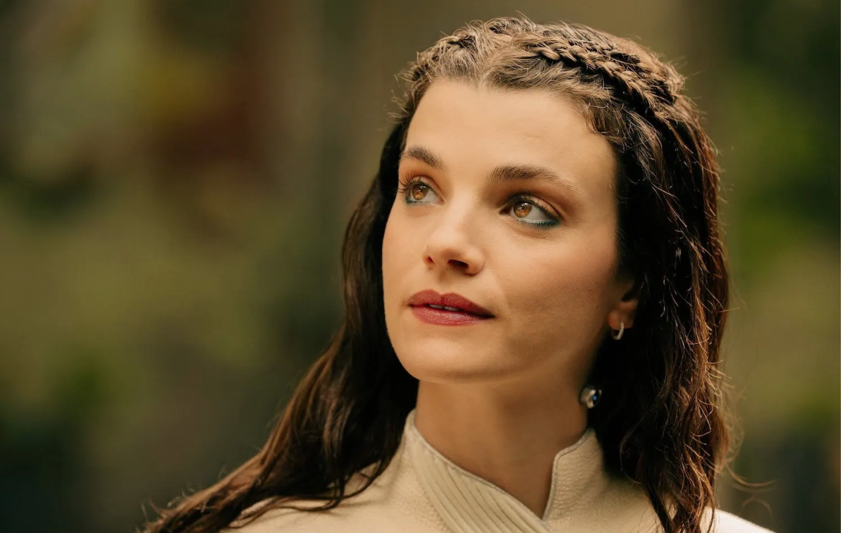 a young woman in white with braided hair