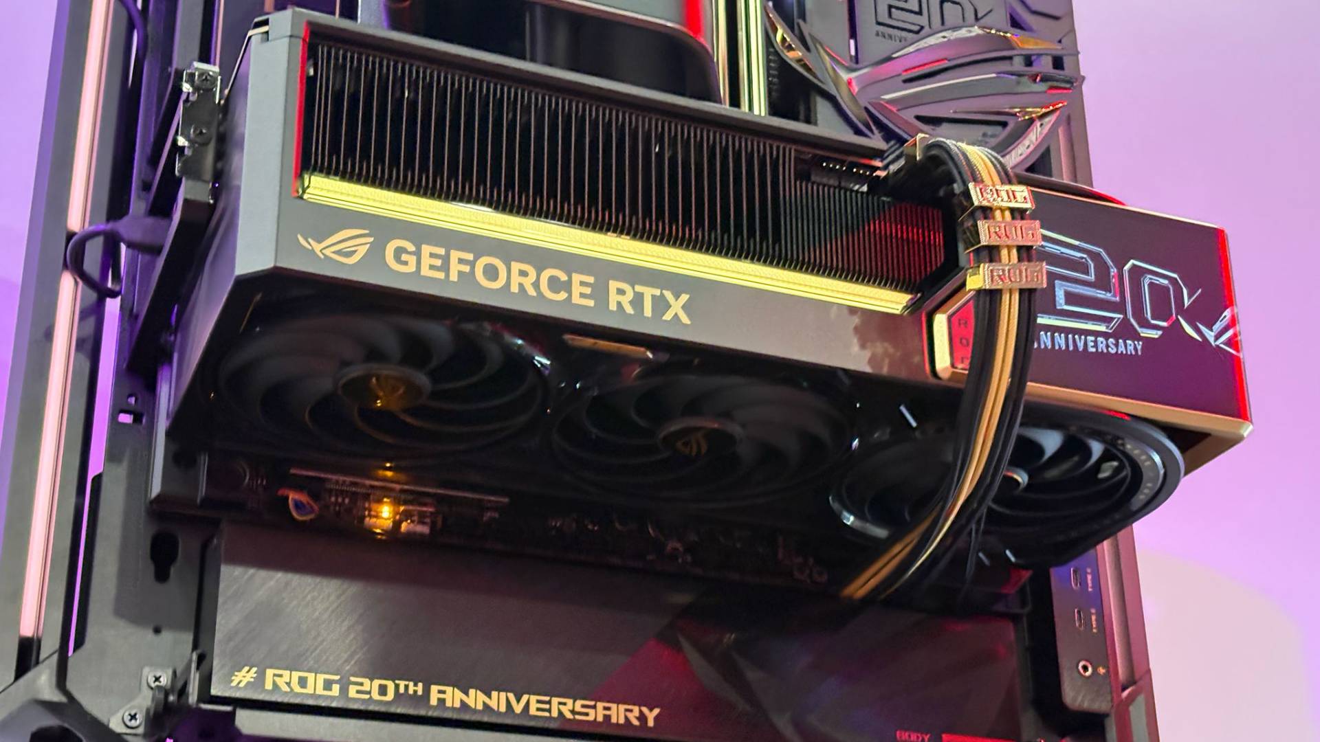 The ROG Astral GeForce RTX 5090 Edition 20 is seen mounted on the open-frame ROG GR20 PC case on the showfloor of Computex 2026.