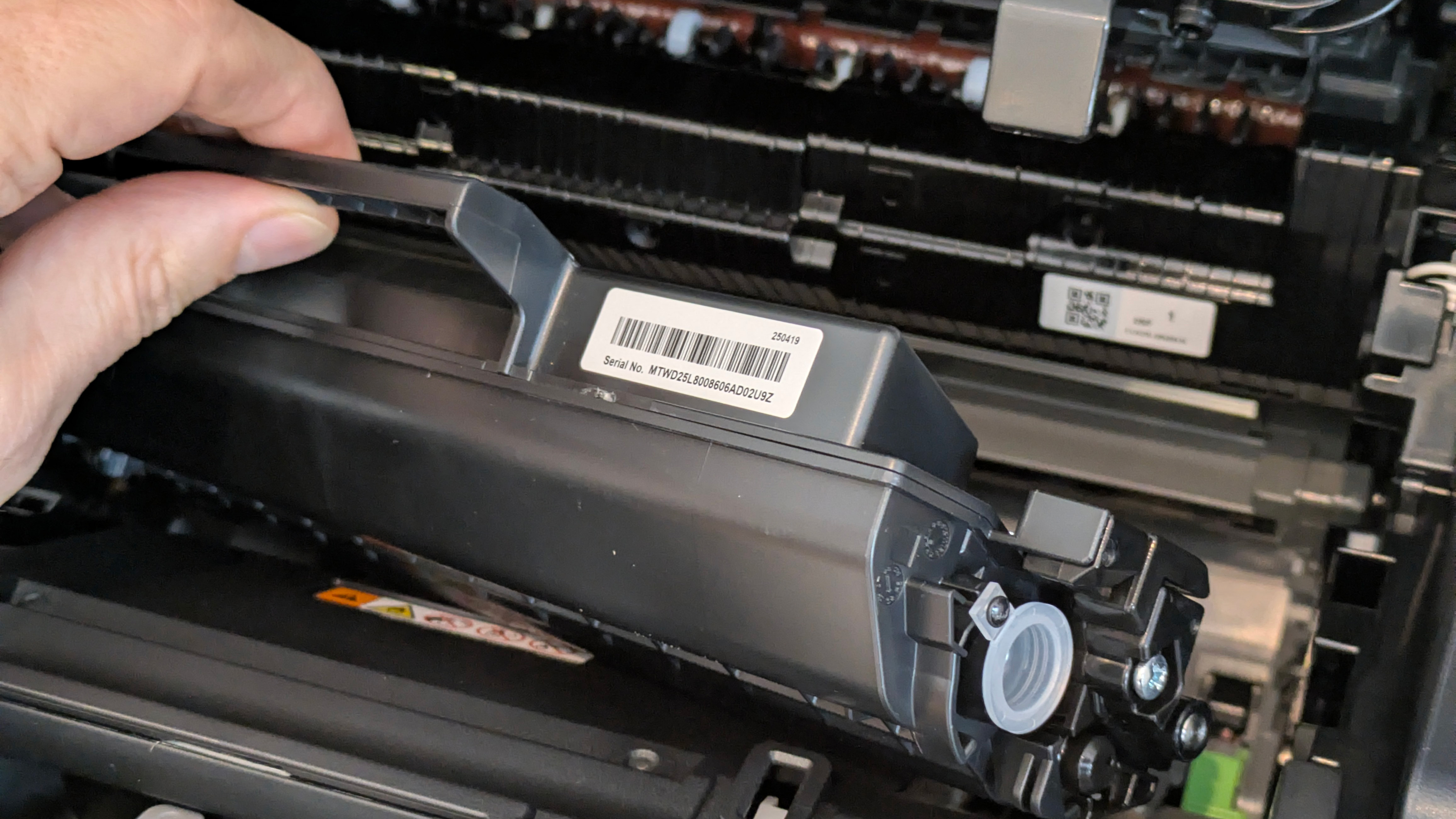 The Brother DCP-L1640W on a desk