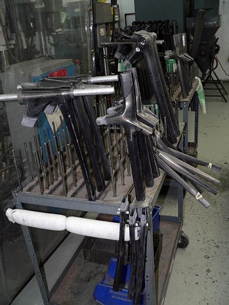 A rack of Madone frame parts await the technician's magic touch.