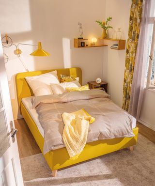 Yellow bedroom idea with yellow bed, lampshade, curtain window treatment by Tom Tailor