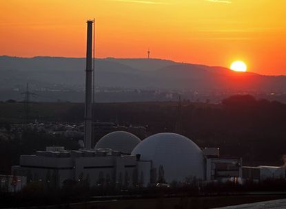 Sun sets over a nuclear power station in Germany