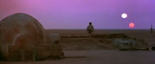 Film still from 'Star Wars Episode IV: A New Hope' showing the sunset on the planet Tatooine. 