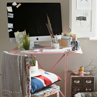 home office with pink table and chair