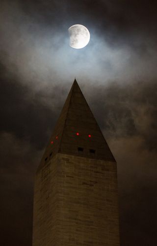 NASA photographer Aubrey Gemignani captured this stunning view of the perigee moon lunar eclipse over the Washington Monument in Washington, D.C. on Sept. 27, 2015.