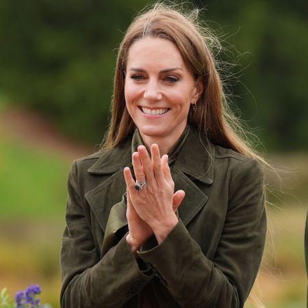Kate Middleton wears a midi skirt with knee-high boots
