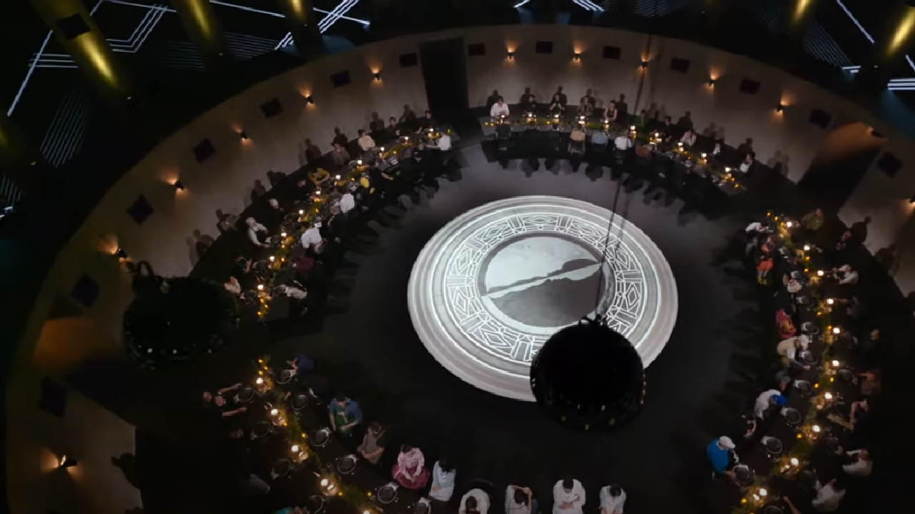 All of the contestants sitting around a table in Culinary Class Wars.