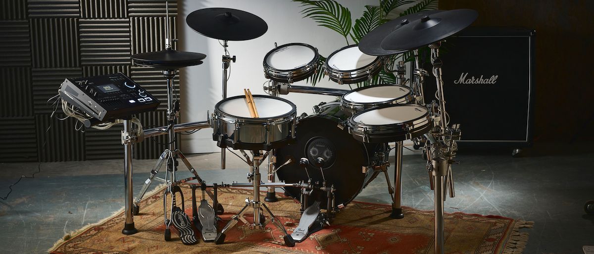 Roland TD716 e-kit in a rehearsal studio with a Marshall cabinet in the background