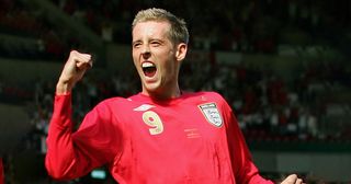 Peter Crouch of England celebrates after completing his hatrick and scoring his team's sixth goal during the International Friendly between England and Jamaica at Old Trafford on June 3, 2006 in Manchester, England.