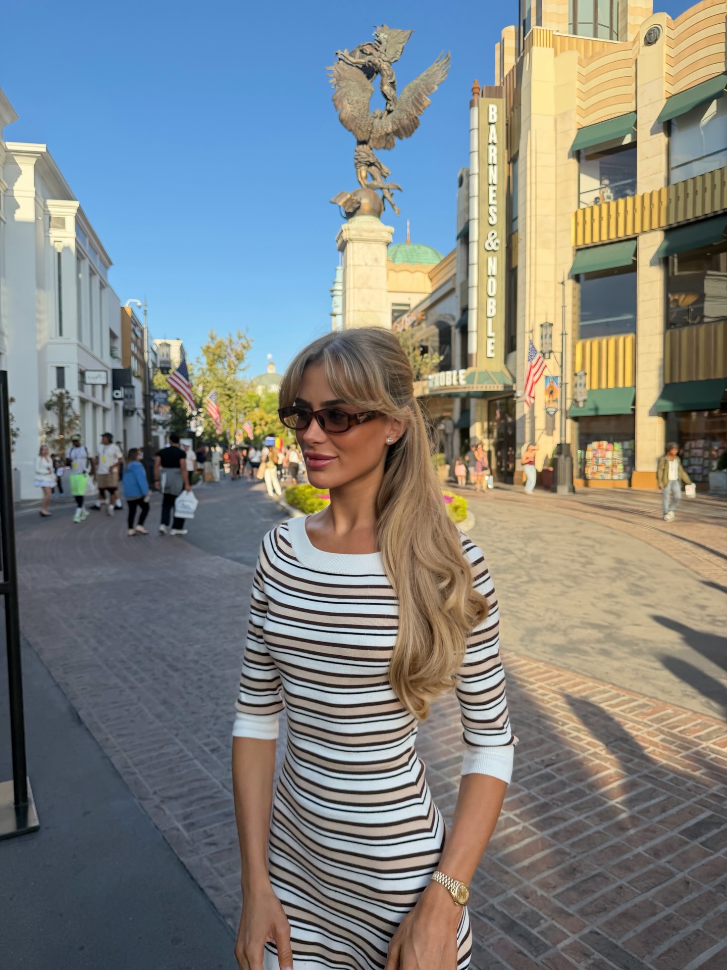 An image of a woman wearing striped dress for summer 2026