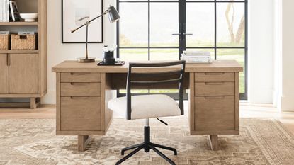 Wooden desk with black office chair