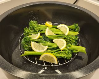 Tenderstem broccoli and lemon slices cooked in GreenPan Omni Cooker