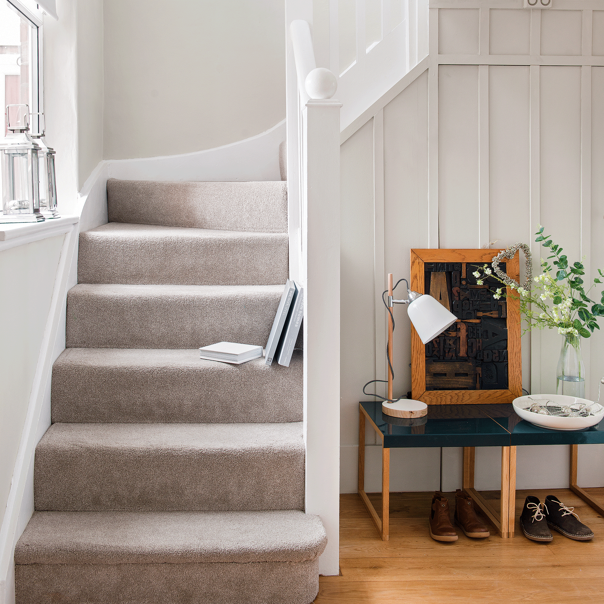 White staircase with carpet and bench