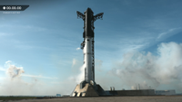 Tall rocket blue sky