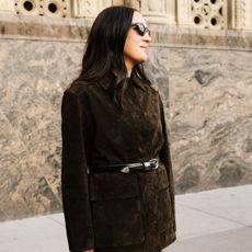 nicole eshaghpour in green suede jacket with a belt shot by @stephgeddes